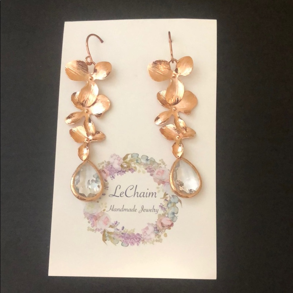 Copper colored earrings with faux diamond bottom